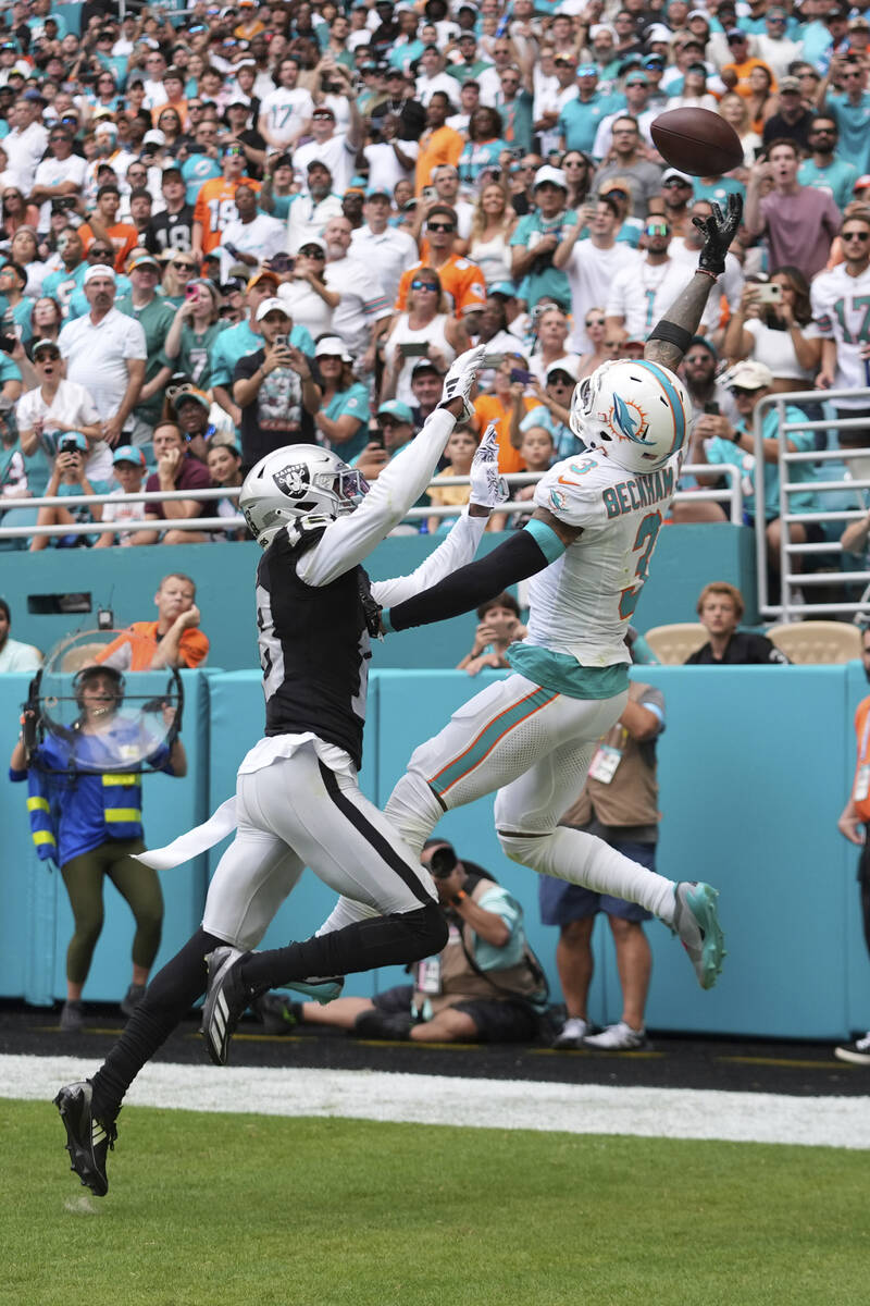 Las Vegas Raiders cornerback Jack Jones (18) defends Miami Dolphins wide receiver Odell Beckham ...