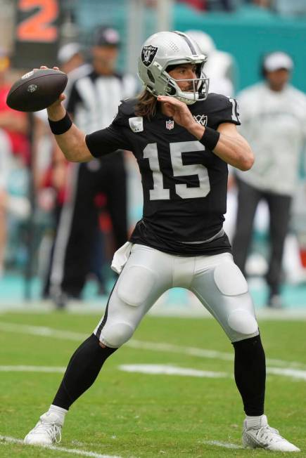 Las Vegas Raiders quarterback Gardner Minshew (15) aims a pass during the second half of an NFL ...