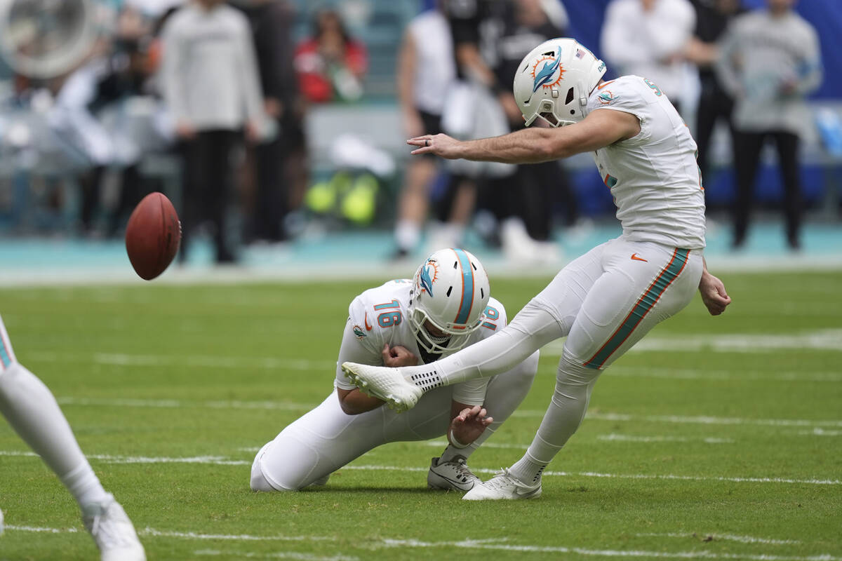 Miami Dolphins place kicker Jason Sanders (7) kicks an extra point during the first half of an ...