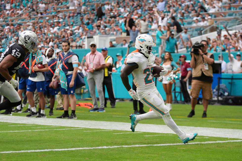 Miami Dolphins running back De'Von Achane (28) scores a touchdown during the second half of an ...