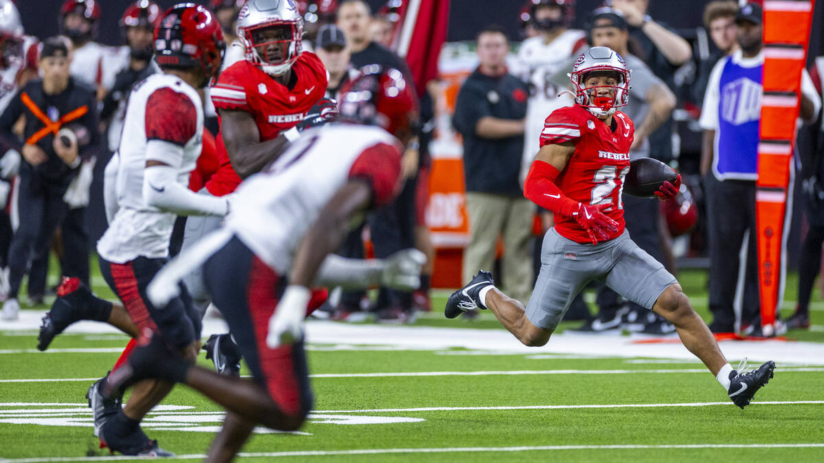 UNLV wide receiver Jacob De Jesus (21) sprints for a long run deep in San Diego State Aztecs te ...