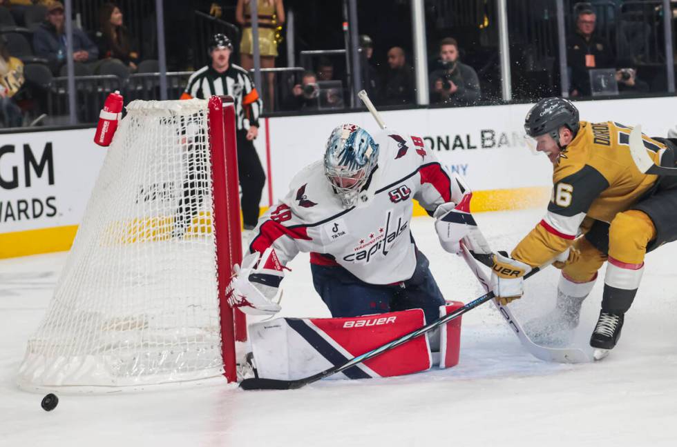 Washington Capitals goaltender Logan Thompson (48) blocks the puck against Golden Knights left ...