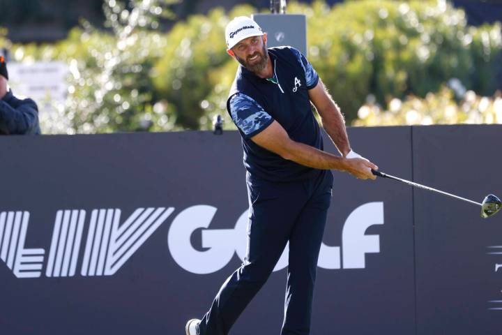 Dustin Johnson of team Aces GC watches his drive off the tee during the first round of LIV Golf ...