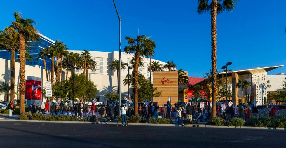 Culinary Local 226 workers on strike on the sidewalk near the main entrance outside the Virgin ...