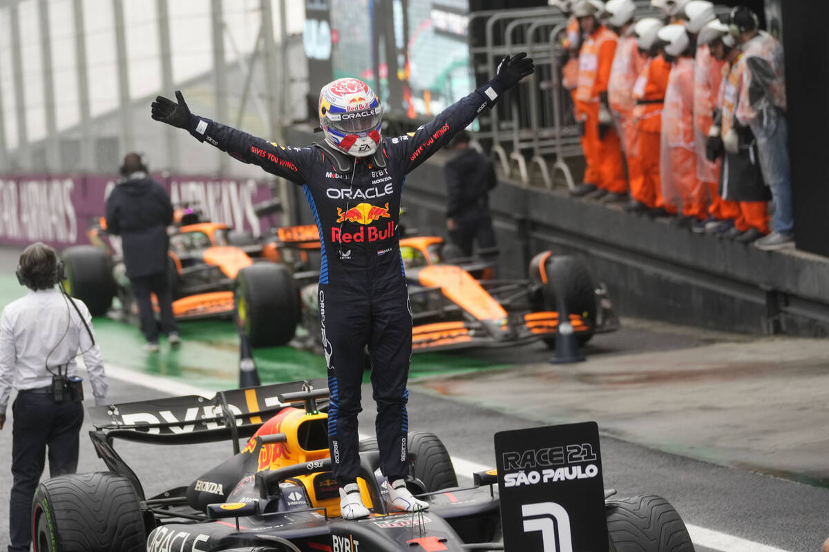 Red Bull driver Max Verstappen, of the Netherlands, celebrates winning the Brazilian Formula On ...