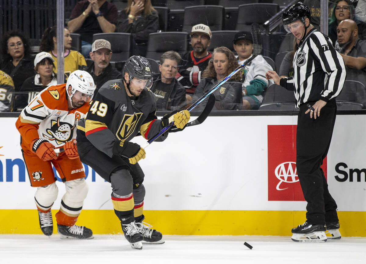 Golden Knights center Ivan Barbashev (49) and Anaheim Ducks left wing Alex Killorn (17) compete ...