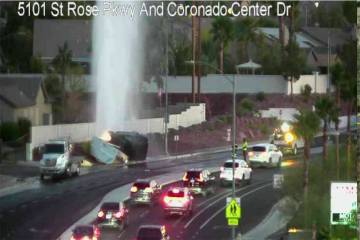 Water is seen erupting from a sidewalk near St. Rose Parkway and Coronado Center Drive on Monda ...