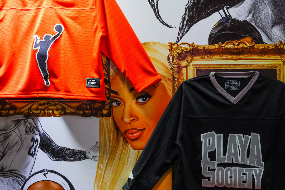 A mural of Connecticut Sun guard DiJonai Carrington is seen between Playa Society jerseys durin ...