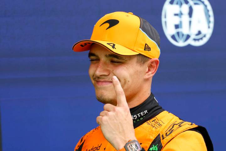 McLaren driver Lando Norris of Britain celebrates after winning the pole position for the Formu ...