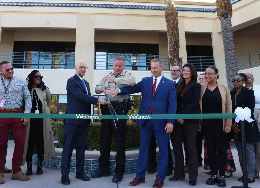 Sheriff Kevin McMahill, center, Dr. James Tenney, director of the Wellness Bureau, left, and Ja ...