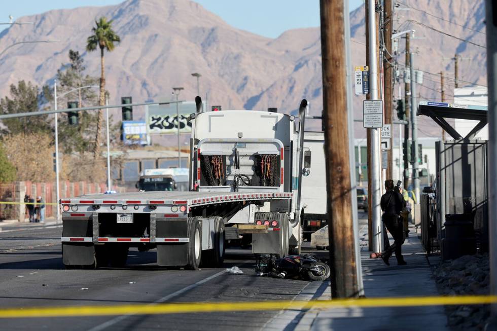 Las Vegas police investigate the scene of a crash involving a pedestrian and semi-truck on West ...