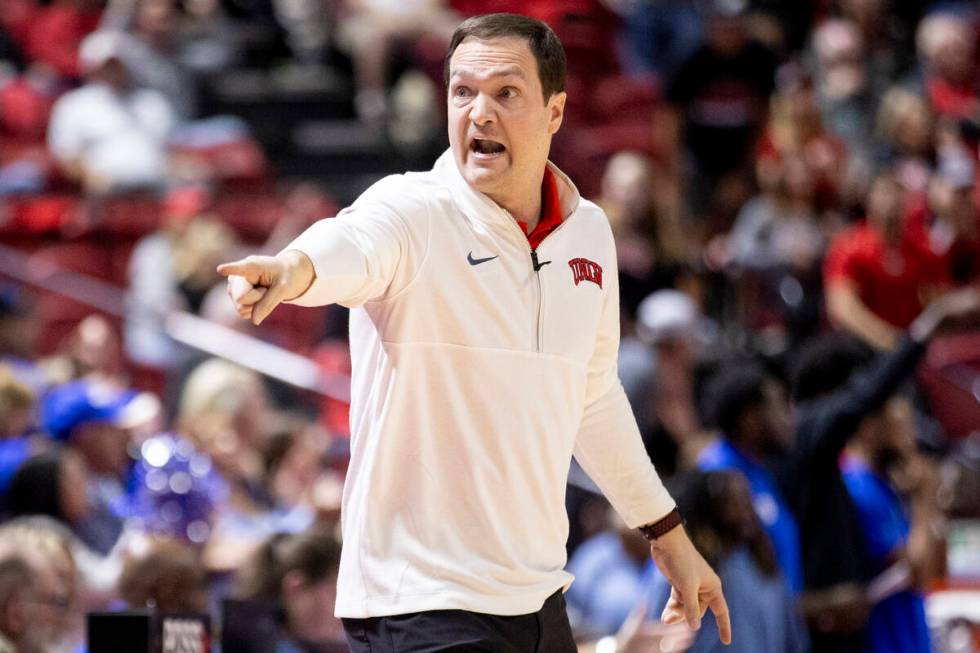 UNLV head coach Kevin Kruger yells toward the bench during the college basketball game against ...