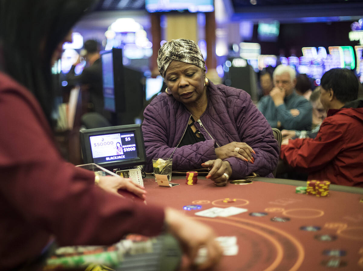 Barbara Wright, of Las Vegas, plays blackjack at Rampart Casino in Las Vegas, Sunday, March 1, ...