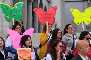 Members of immigration advocacy groups demand the City Council enact an ordinance making Los An ...