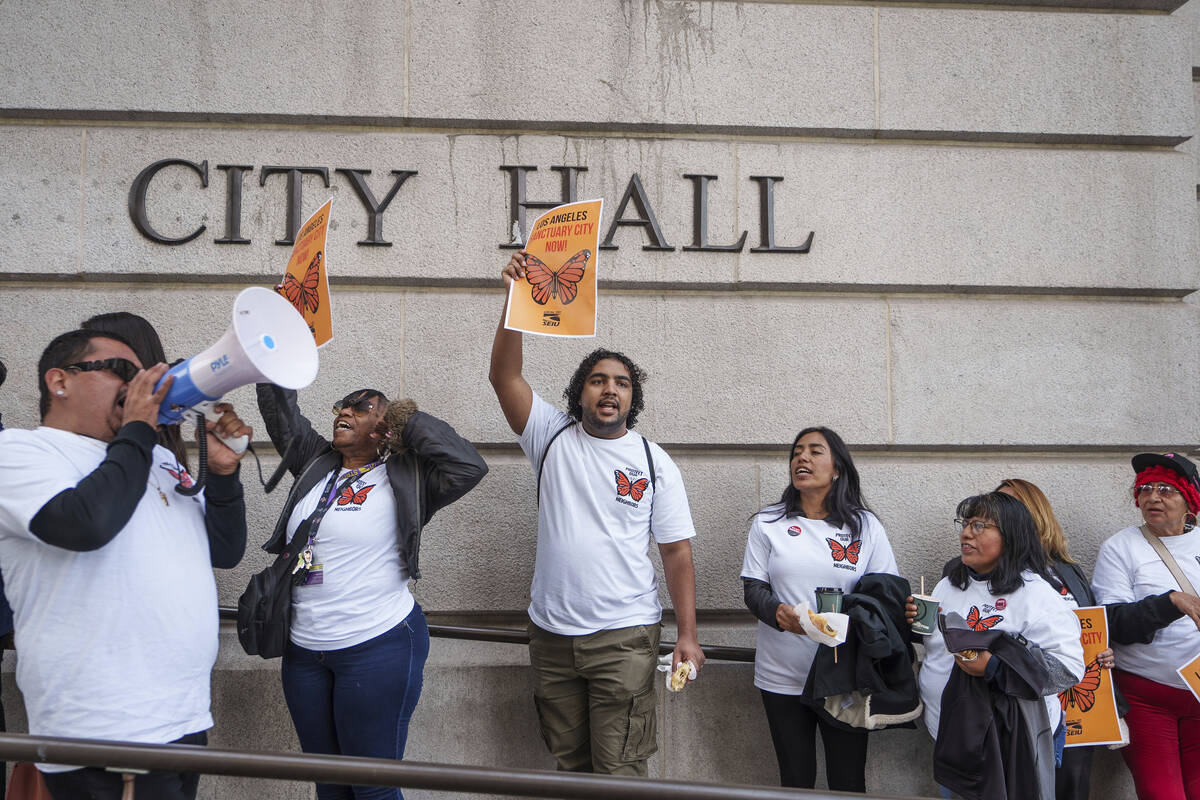 Members of immigration advocacy groups demand the City Council enact an ordinance making Los An ...