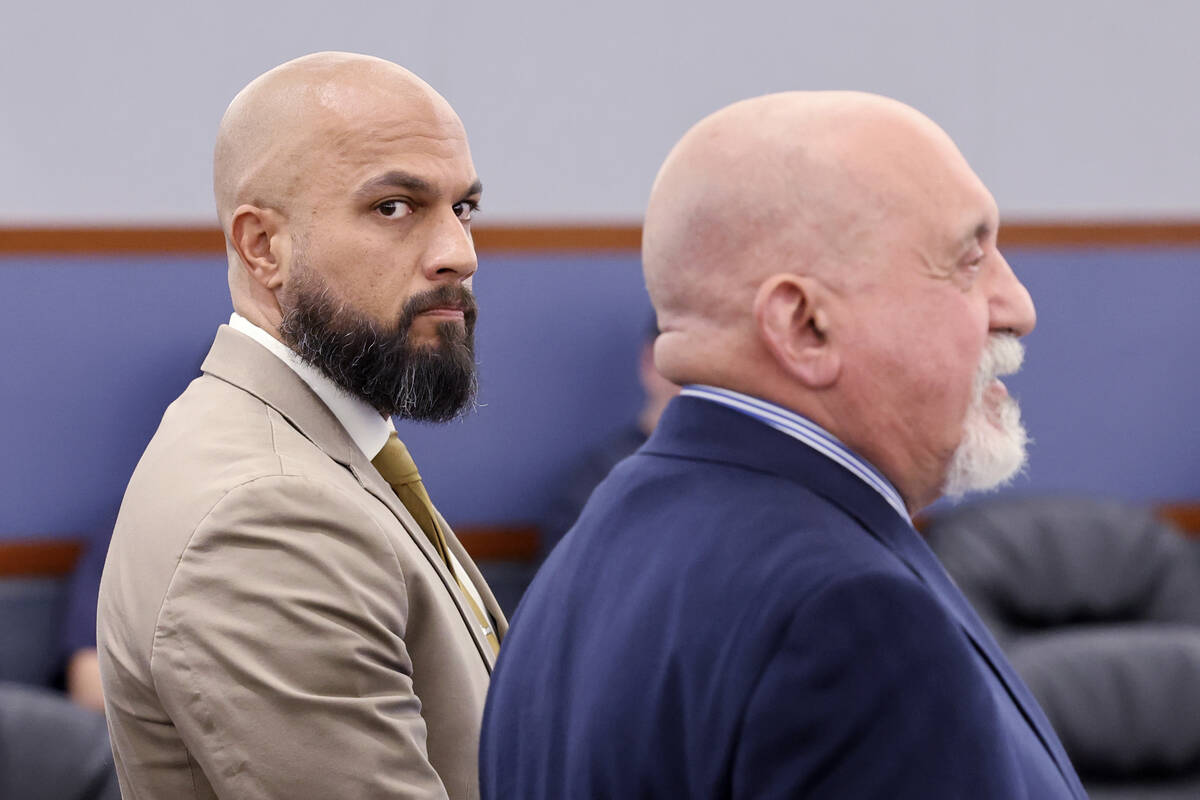 Metropolitan Police Department Sgt. Kevin Menon, left, appears in court with his attorney Domin ...