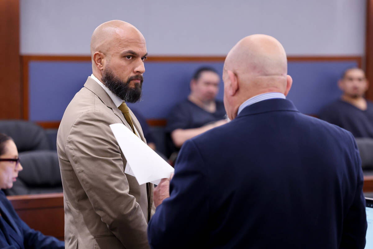 Metropolitan Police Department Sgt. Kevin Menon, left, appears in court with his attorney Domin ...