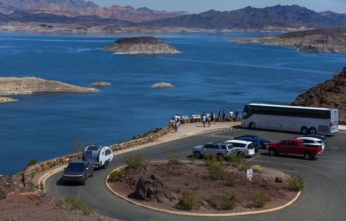 A tour bus drops off passengers to view Lake Mead from the Lakeview Overlook on Aug. 15, 2024, ...