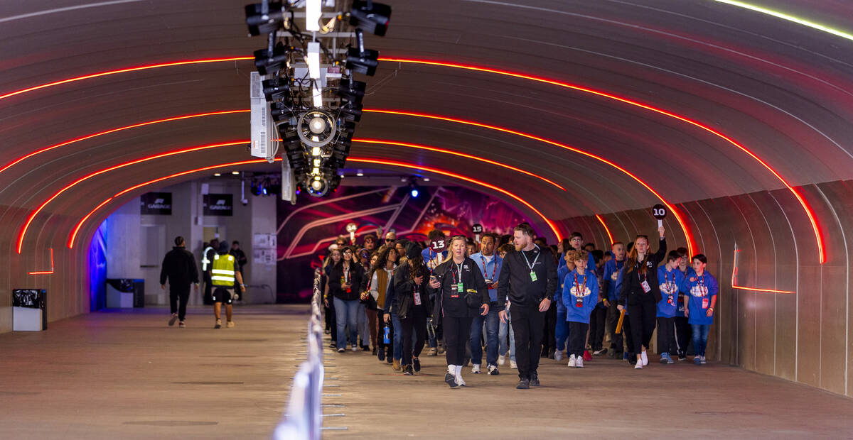 Clark County School District students and staff are escorted during a tour through the tunnel b ...