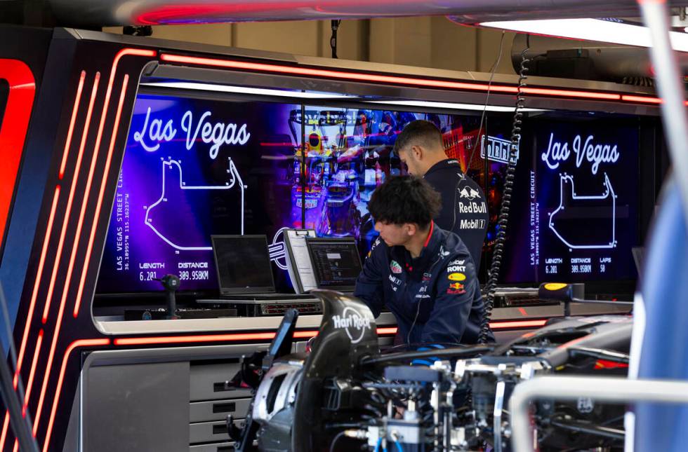 Technicians work on the car of Red Bull driver Max Verstappen in his garage at the Formula 1 ...