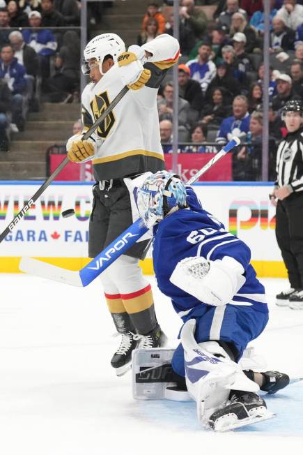 Vegas Golden Knights' Keegan Kolesar (55) evades the puck in front Toronto Maple Leafs' goalten ...