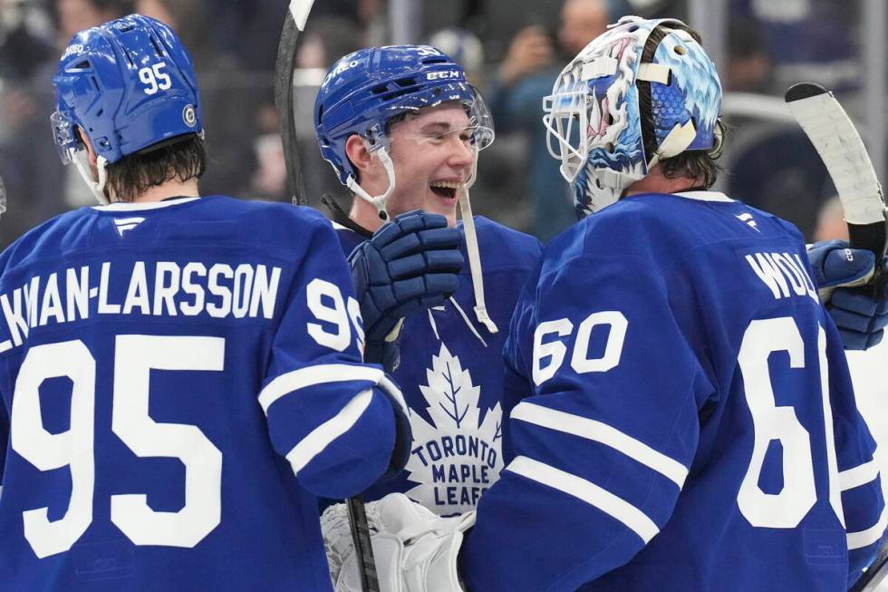 Toronto Maple Leafs' Fraser Minten (39) congratulates Toronto Maple Leafs' goaltender Joseph Wo ...