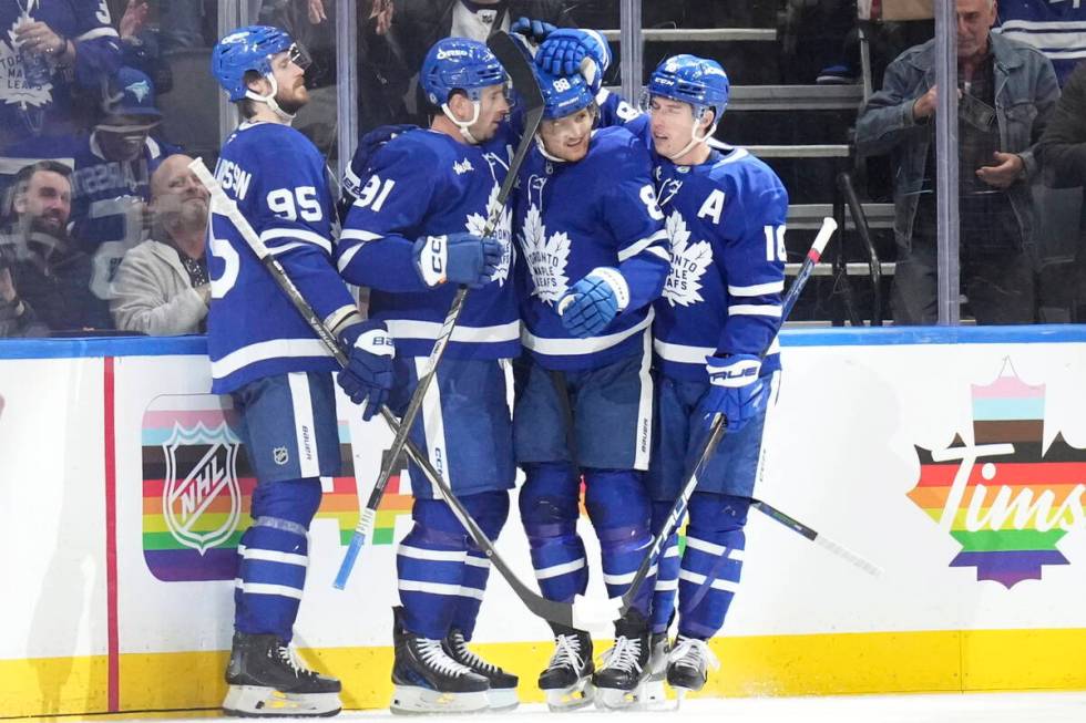 Toronto Maple Leafs' William Nylander (88) celebrates with John Tavares (91) Mitch Marner (16) ...