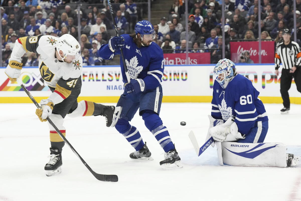 Toronto Maple Leafs goaltender Joseph Woll (60) makes a stop in front of Vegas Golden Knights I ...