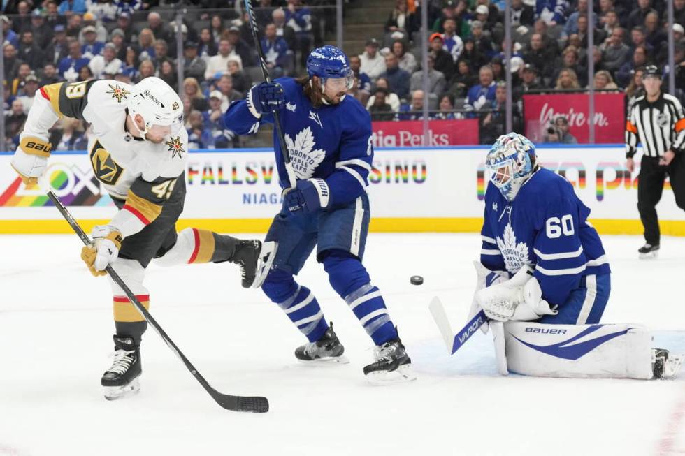 Toronto Maple Leafs goaltender Joseph Woll (60) makes a stop in front of Vegas Golden Knights I ...