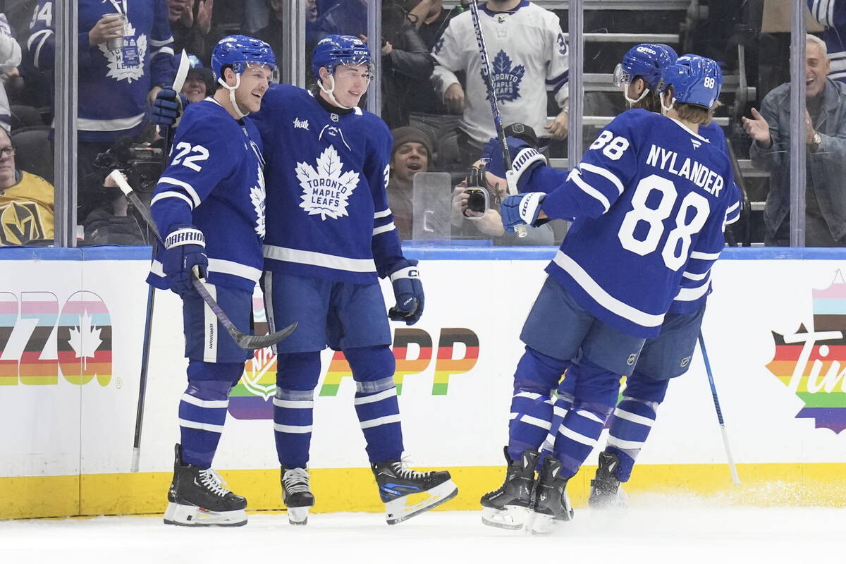 Toronto Maple Leafs' Fraser Minten (39) celebrates with Jake McCabe (22) and William Nylander ( ...