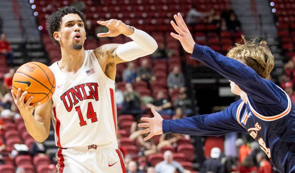 UNLV guard Jailen Bedford (14) directs his teammates during the college basketball game against ...