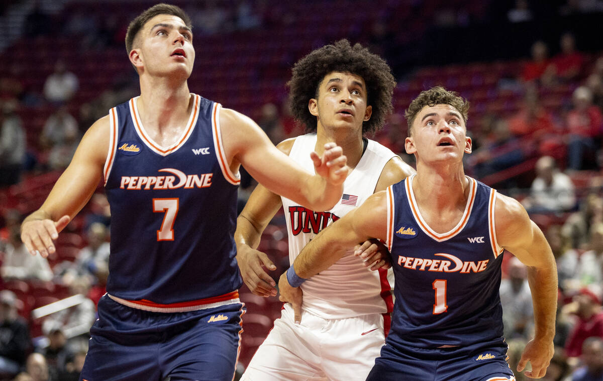 Pepperdine Waves forward Stefan Todorovic (7), UNLV forward Jalen Hill, center, and Pepperdine ...