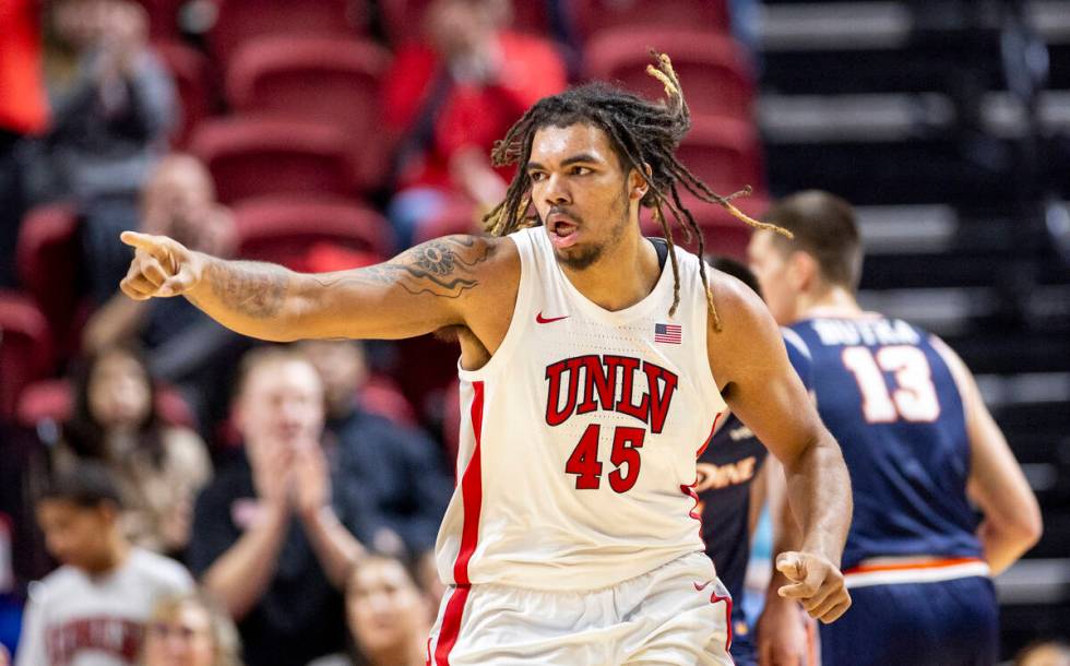 UNLV forward Jeremiah Cherry (45) points to a teammate after scoring a basket during the colleg ...