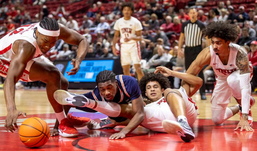 From left: UNLV forward Jacob Bannarbie, Pepperdine Waves guard Zion Bethea, UNLV forward Jalen ...