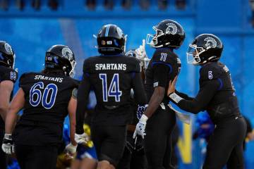 San Jose State wide receiver Justin Lockhart (11) celebrates with teammates after scoring again ...