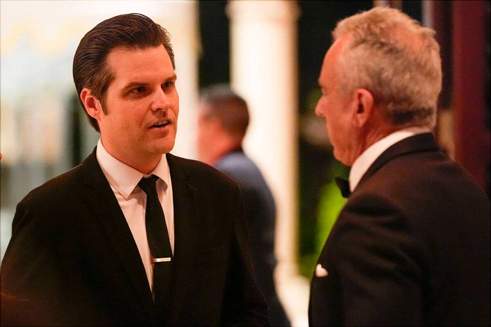 Matt Gaetz talks with Robert F. Kennedy Jr., before President-elect Donald Trump speaks during ...