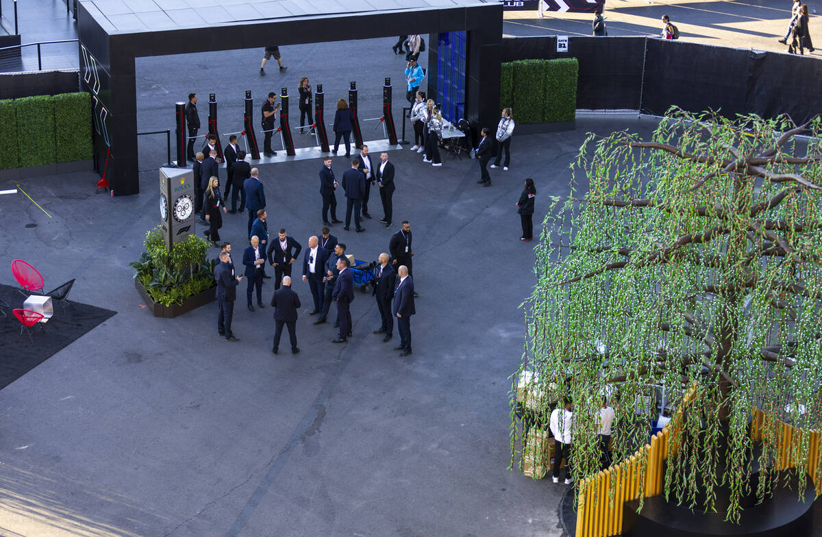 Personnel gather outside the Formula One pit building before the start of the Las Vegas Grand P ...