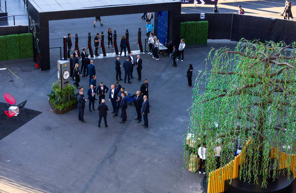 Personnel gather outside the Formula One pit building before the start of the Las Vegas Grand P ...