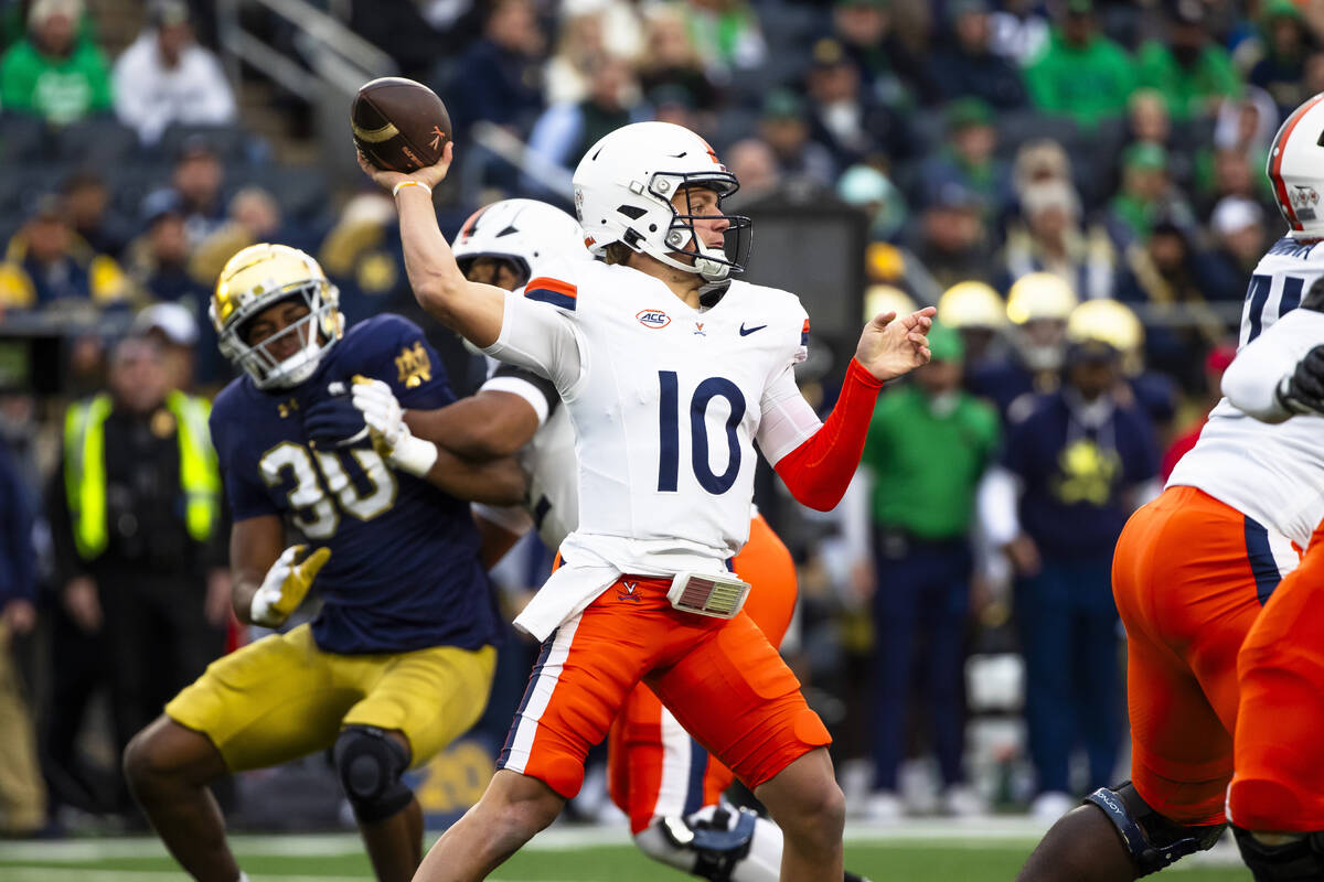 Virginia quarterback Anthony Colandrea (10) throws a pass during first half of an NCAA college ...