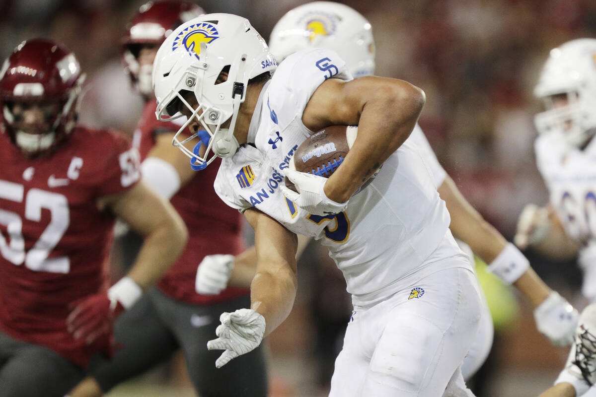 San Jose State wide receiver Nick Nash, center, carries the ball during the second half of an N ...