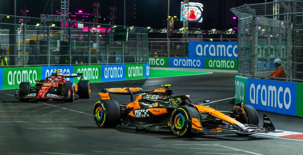 McLaren driver Lando Norris leads Ferrari driver Carlos Sainz around a corner at the Sphere dur ...