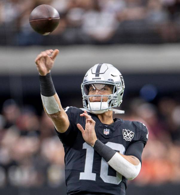 Raiders quarterback Desmond Ridder (10) throws the ball during warmups before the NFL football ...