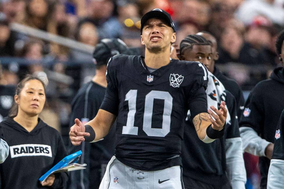 Raiders quarterback Desmond Ridder (10) reacts to a roughing the passer penalty against the tea ...