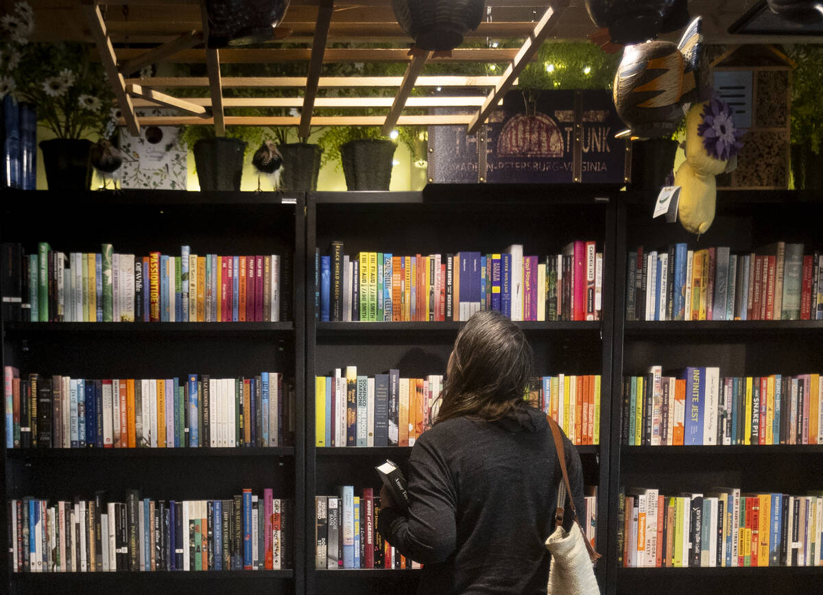 Wendy Fredman, of Las Vegas, peruses a bookshelf at the Writer’s Block, Wednesday, Nov. ...