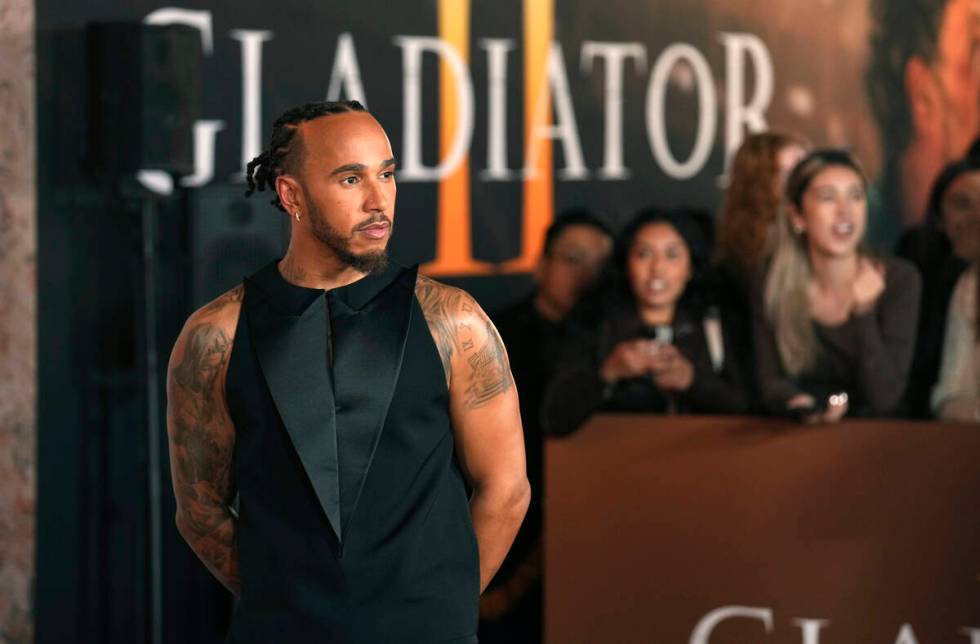 Race car driver Lewis Hamilton poses at the premiere of the film "Gladiator II" on Mo ...