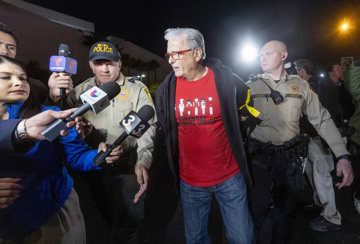 Culinary Workers Union Secretary-Treasurer Ted Pappageorge attempts to talk to the media after ...