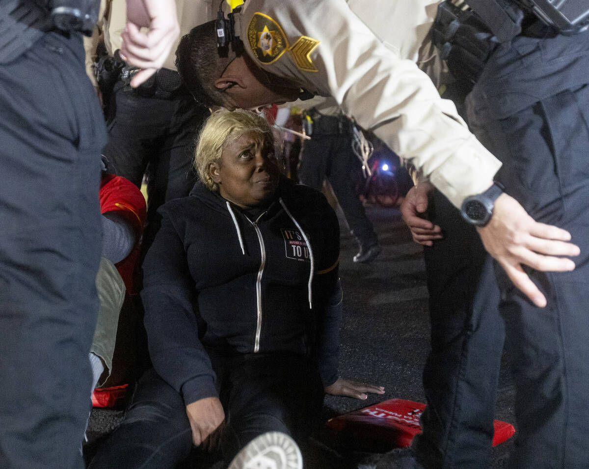 Culinary Workers Union members and Virgin Hotels workers are surrounded by Metropolitan Police ...