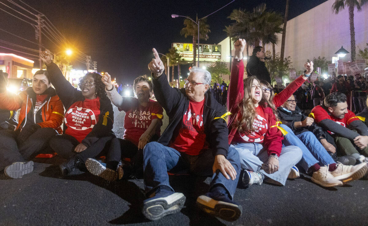 Culinary Workers Union Secretary-Treasurer Ted Pappageorge, center, leads a chant during a prot ...