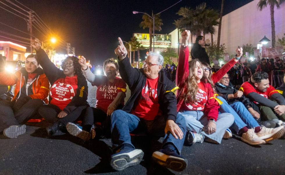 Culinary Workers Union Secretary-Treasurer Ted Pappageorge, center, leads a chant during a prot ...