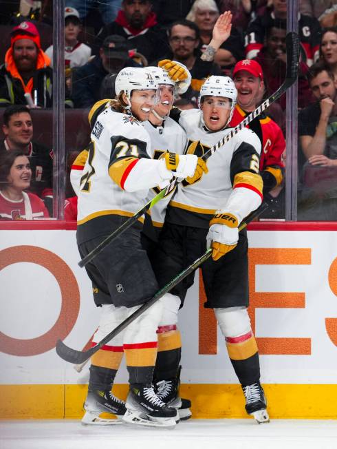 Vegas Golden Knights left wing Pavel Dorofeyev, center, celebrates after his goal with teammate ...